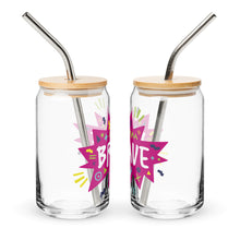 Load image into Gallery viewer, A photo of two glass can tumblers on a white background showing the side of the glasses. The glass tumblers have a bamboo lid and silver metal straw. The design on the glass tumbler says the word &quot;brave&quot; inside a hot pink star with illustrated sketchy elements around the word. 