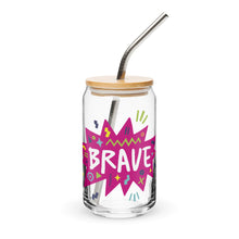 Load image into Gallery viewer, A photo of a glass can tumbler on a white background with a bamboo lid and silver metal straw. The design on the glass tumbler says the word &quot;brave&quot; inside a hot pink star with illustrated sketchy elements around the word. 