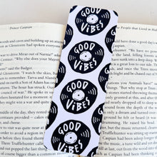 Load image into Gallery viewer, A close up of a bookmark with the words &quot;good vibes&quot; featured inside an illustrated vinyl record. 