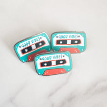 Load image into Gallery viewer, Three enamel pins featuring the words &quot;good vibes&quot; inside an illustrated cassette tape.