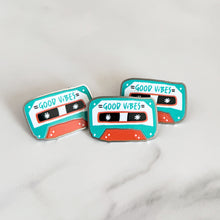 Load image into Gallery viewer, Three enamel pins featuring the words &quot;good vibes&quot; inside an illustrated cassette tape.