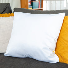 Load image into Gallery viewer, An image showing the back of the pillow on a sofa. The back of the pillow is white. 