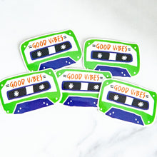 Load image into Gallery viewer, Vinyl die cut stickers with the words &quot;good vibes&quot; inside an illustrated cassette tape. 