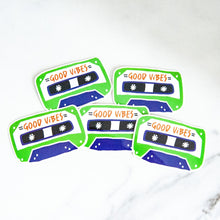 Load image into Gallery viewer, Vinyl die cut stickers with the words &quot;good vibes&quot; inside an illustrated cassette tape. 