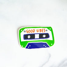 Load image into Gallery viewer, A vinyl die cut sticker with the words &quot;good vibes&quot; inside an illustrated cassette tape. 