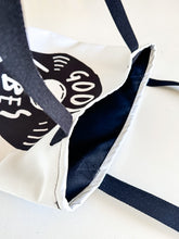 Load image into Gallery viewer, A close up showing the inside of the tote bag.