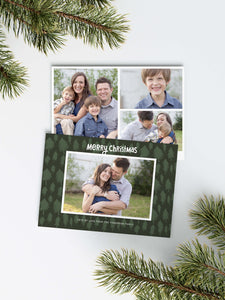 A photo of a Christmas card showing the front and back of the card laying on a white surface. Around the two sides of the card are pine needles. The front of the card features a photo with a frame around it with illustrated pine trees. Above the photo reads “Merry Christmas” and below the photo you can add your family name. The back of the card features three photos with illustrated pine trees. 