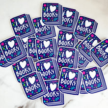 Load image into Gallery viewer, Vinyl die cut stickers featuring the words &quot;I Love Books&quot; inside an illustrated book. 