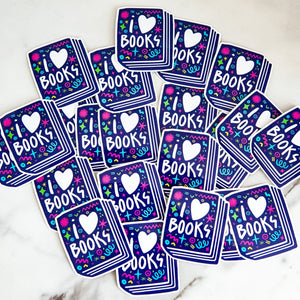 Vinyl die cut stickers featuring the words "I Love Books" inside an illustrated book. 