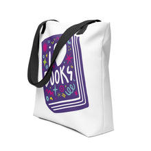 Load image into Gallery viewer, A side view of a white tote bag with black handles on a white background. The tote bag has a design with the words &#39;I love books&#39; with the word love shown as a heart. The words are inside an illustrated book. 