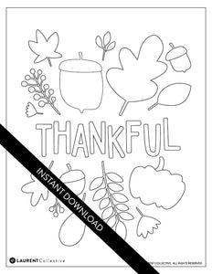 An image showing the coloring page. The letters and design are featured with open space to be able to be coloured in. The coloring page features the words “Thankful" with illustrated leaves and an acorn around the word.
