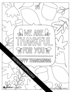An image showing the coloring page. The letters and design are featured with open space to be able to be coloured in. The coloring page features the words "We are Thankful for You, Happy Thanksgiving" with illustrated leaves and acorns around the words. 