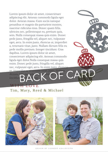 A close up of the back of the card showing the two photos and design features. Across the image is a gray strip with the words “back of card” on it. The back of the card features two photos, illustrated ornaments and space to write a family update.