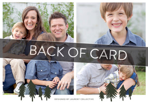 A close up of the back of the card showing the two photos and design features. Across the image is a gray strip with the words “back of card” on it. The back of the card features three photos with illustrated pine trees. 