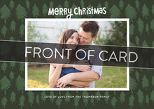 Load image into Gallery viewer, A close up of the front of the card showing the front of the card design. Across the image is a gray strip with the words “front of card” on it.  The front of the card features a photo with a frame around it with illustrated pine trees. Above the photo reads “Merry Christmas” and below the photo you can add your family name. 