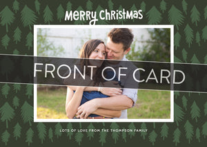 A close up of the front of the card showing the front of the card design. Across the image is a gray strip with the words “front of card” on it.  The front of the card features a photo with a frame around it with illustrated pine trees. Above the photo reads “Merry Christmas” and below the photo you can add your family name. 
