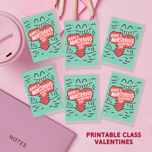 Printable class valentines shown on a table. 