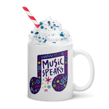 Load image into Gallery viewer, A white mug on a white background with whipped cream and a straw. The mug features a design with the words &#39;music speaks&#39; in an illustrated musical note with sketchy elements around it.