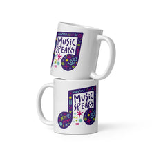 Load image into Gallery viewer, Two white mugs stacked on top of each other.  The mug features a design with the words &#39;music speaks&#39; in an illustrated musical note with sketchy elements around it.