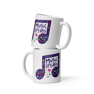 Two white mugs stacked on top of each other.  The mug features a design with the words 'music speaks' in an illustrated musical note with sketchy elements around it.