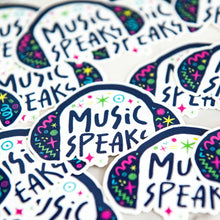 Load image into Gallery viewer, Vinyl die cut stickers with the words &quot;music speaks&quot; with illustrated headphones around the words. 