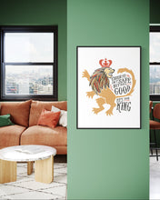 Load image into Gallery viewer, Artwork in a black frame with the with a white matte. The frame is hanging on a wall in a living room. The artwork features an illustrated with the words &quot;Course He Isn&#39;t Safe, But He&#39;s Good. He&#39;s the King.&quot;