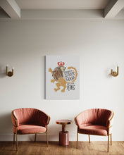 Load image into Gallery viewer, A white canvas with artwork hanging on a wall above two chairs. The artwork features an illustrated lion with a crown and reads &quot;Course He Isn&#39;t Safe, But He&#39;s Good. He&#39;s the King.&quot;