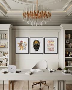 A set of three artwork prints hanging on a wall of an office. The artwork is inspired by the Chronicles of Narnia. The first print reads "Course He Isn't Safe, But He's Good. He's the King." The second print reads "At The Sound of Your Roar, Sorrows Will Be No More," and the last print reads "Once a king or queen of Narnia, always a king or queen of Narnia."