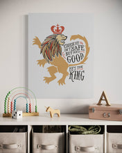 Load image into Gallery viewer, A white canvas with artwork hanging on a wall above a kids playroom organizer. The artwork features an illustrated lion with a crown and reads &quot;Course He Isn&#39;t Safe, But He&#39;s Good. He&#39;s the King.&quot;