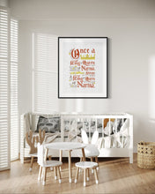 Load image into Gallery viewer, Artwork in a black frame with the with a white matte. The frame is on the wall of a nursery above a crib. The artwork features hand drawn lettering of the Narnia quote &quot;Once a king or queen of Narnia, always a king or queen of Narnia.&quot;