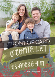 A close up of the card showing the photo and design features. Across the image is a gray strip with the words “back of card” on it. The photo card features one photo with the words “O Come Let Us Adore Him” below with illustrated red leaves. 