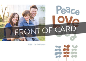 A close up of the front of the card showing the front of the card design. Across the image is a gray strip with the words “front of card” on it. The front of the card features a photo on the left side with the words “Peace Love Joy” with modern illustrated leaves below. 