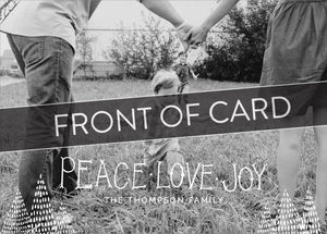 A close up of the card showing the photo and design features. Across the image is a gray strip with the words “back of card” on it. The card features a photo with the words “Peace Love Joy” over the photo and a space to put your family name below. There are illustrated modern trees on the bottom. 