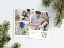 Load image into Gallery viewer, A photo of a Christmas card showing the front and back of the card laying on a white surface. Around the two sides of the card are pine needles. The front of the card features a photo with the words “Peace Love joy” to the bottom right and space to the bottom left to put your family names. The words feature some modern illustrated flowers around it. The back of the card features three photos with modern illustrated flowers.