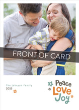 Load image into Gallery viewer, A close up of the front of the card showing the front of the card design. Across the image is a gray strip with the words “front of card” on it. The front of the card features a photo with the words “Peace Love joy” to the bottom right and space to the bottom left to put your family names. The words feature some modern illustrated flowers around it. 
