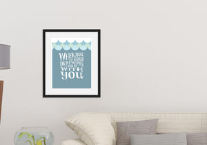 Lettering artwork is featured in a black frame above a sofa. The artwork features hand drawn lettering reading "When you go through deep waters, I will be with you."