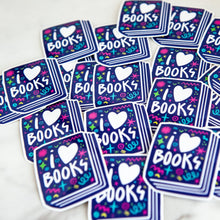 Load image into Gallery viewer, Vinyl die cut stickers featuring the words &quot;I Love Books&quot; inside an illustrated book. 