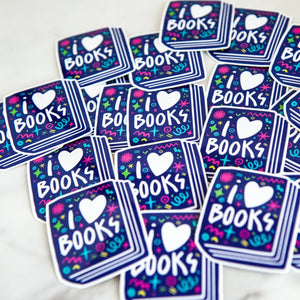 Vinyl die cut stickers featuring the words "I Love Books" inside an illustrated book. 