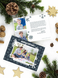 A photo of a two-sided Christmas card showing the front of the card on top of a brown wrapped gift on a white tabletop. Around the gift are pine needles, pinecones and wood star ornaments. The front of the card features a photo with a frame around it with illustrated snowflakes. Above the photo reads “Merry Christmas” and below the photo you can add your family name. The back of the card features two photos, illustrated snowflakes and a place to add a family update. 