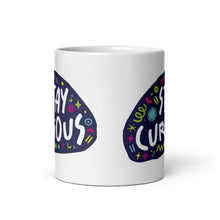 Load image into Gallery viewer, A side view of a white mug on a white background. The mug features a design with the words &#39;stay curious&#39; in an illustrated oval shape with sketchy elements around it. 