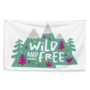 A large flag featured on a white background. The white flag features the words 'wild and free' inside illustrated mountains with sketch trees and other elements around.