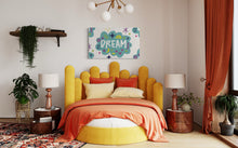 Load image into Gallery viewer, A large flag featured on the wall of a teenager&#39;s room above a a bed. The white flag features a pattern with the word &quot;dream&quot; featured inside a cloud with sketchy illustrations around the word. 