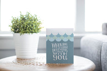 Load image into Gallery viewer, A greeting card laying on a wooden table with some cut wood details. The card features the words “When you go through deep waters, I will be with you.”
