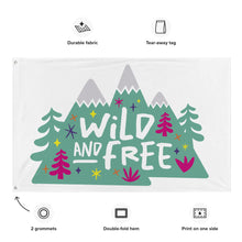 Load image into Gallery viewer, A large white flag shown on a white background. The white flag features the words &#39;wild and free&#39; inside illustrated mountains with sketch trees and other elements around. Details of the flag are noted around the image reading &quot;durable fabric, tear-away tag, 2 grommets, double-fold hem, print on one side.&quot;