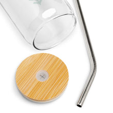 Load image into Gallery viewer, A photo showing the detail of the glass tumbler. The lid detail shows the bamboo lid and the straw insert. The metal straw is shown too. 