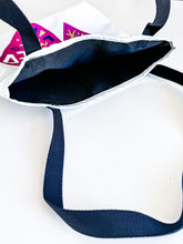 Load image into Gallery viewer, A close up showing the inside of the tote bag.