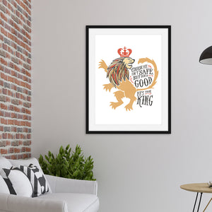 A black frame hanging on a wall of a living room. The artwork features an illustrated with the words "Course He Isn't Safe, But He's Good. He's the King." 