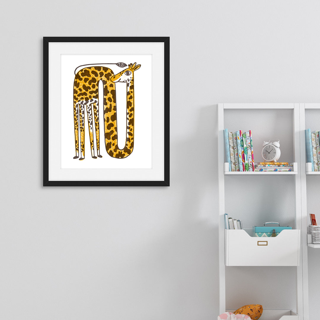 An illustration of a yellow giraffe in a black frame. The frame is hanging on the wall next to a bookshelf in a nursery.