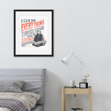 Load image into Gallery viewer, Artwork featured in a black frame in a bedroom above a bed. The artwork is printed on white paper and features black and red hand drawn lettering with the Bible verse Philippians 4:13 &quot;I can do everything through him who gives me strength.&quot; 