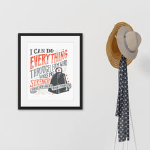 Load image into Gallery viewer, Black framed artwork next to coat rack featuring a white paper print with black and red lettering featuring the Bible verse Philippians 4:13 &quot;I can do everything through him who gives me strength.&quot; 
